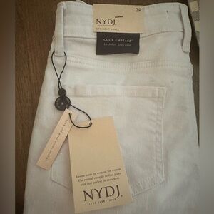 NYDJ Women's white straight ankle 2 petite pants. NWT 25 inseam. Small dust spot